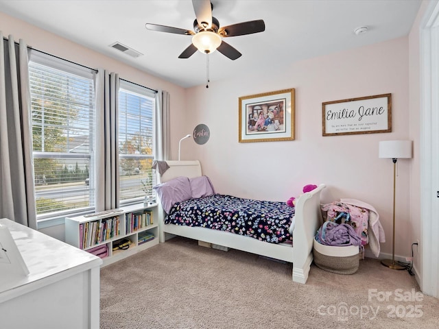 carpeted bedroom with ceiling fan