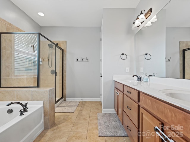 bathroom featuring tile patterned flooring, vanity, and plus walk in shower