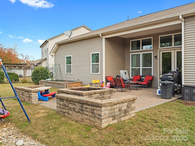 back of property featuring a lawn, an outdoor living space, a playground, and a patio