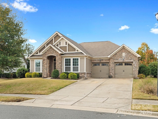 craftsman-style home with a front yard and a garage