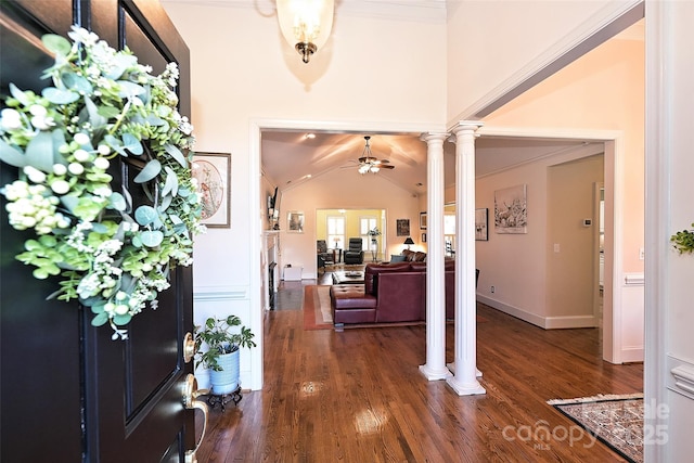 foyer featuring ceiling fan, vaulted ceiling, dark hardwood / wood-style floors, and ornate columns