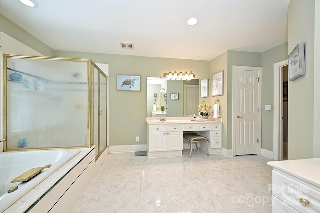 bathroom featuring vanity and shower with separate bathtub