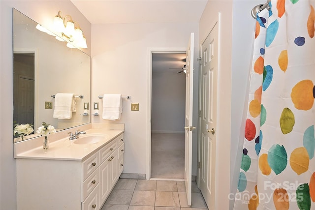 bathroom with ceiling fan, vanity, and tile patterned flooring