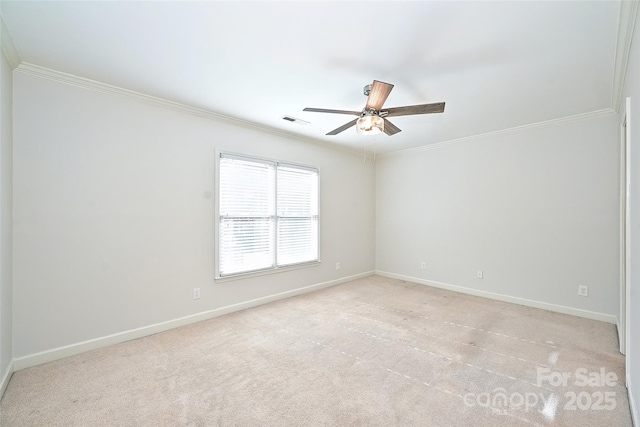 carpeted empty room with ceiling fan and ornamental molding