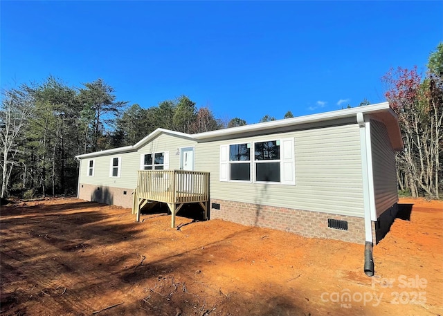 rear view of house with a deck