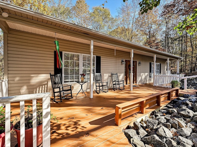 wooden terrace featuring a porch