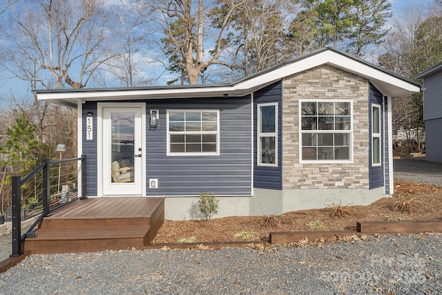 view of front of house featuring a wooden deck