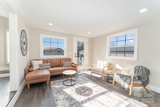 living room featuring dark hardwood / wood-style floors and plenty of natural light