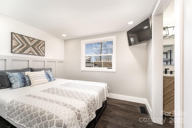 bedroom featuring dark hardwood / wood-style flooring