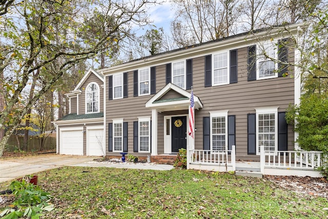 colonial home with a garage