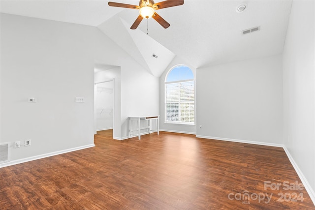 unfurnished living room featuring ceiling fan, high vaulted ceiling, and wood-type flooring