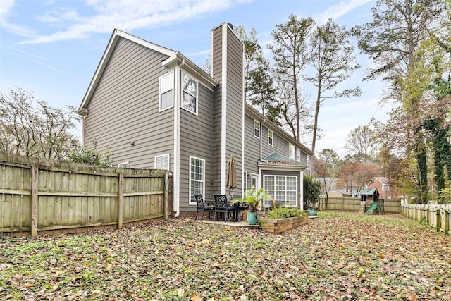 rear view of house with a patio