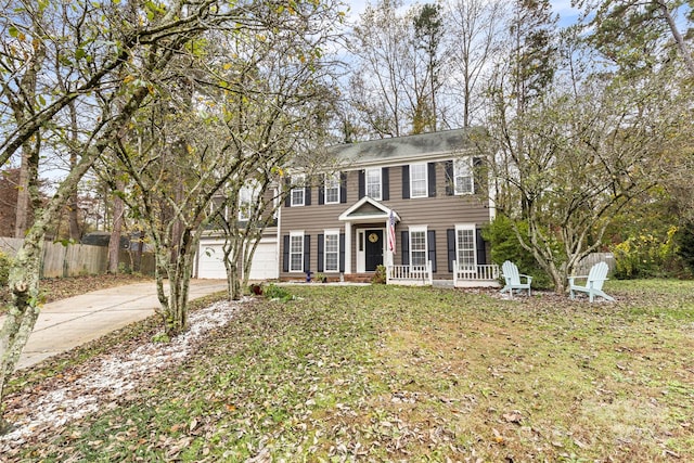 view of front of house featuring a front yard and a garage