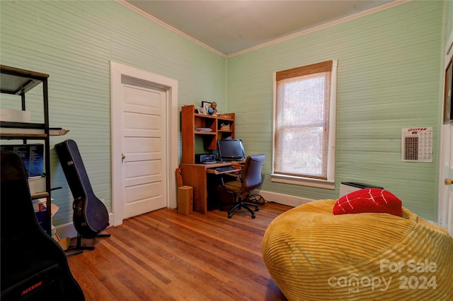 office with hardwood / wood-style floors and ornamental molding