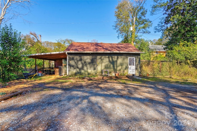 view of home's exterior with a carport