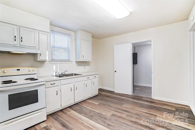 kitchen featuring white range with electric stovetop, white cabinetry, sink, and light hardwood / wood-style flooring