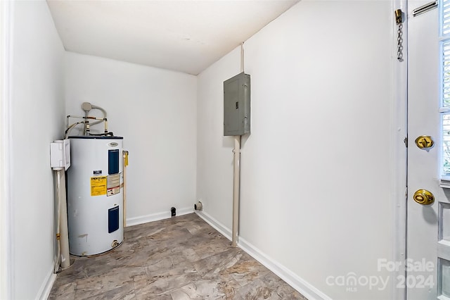 utility room with electric panel and electric water heater