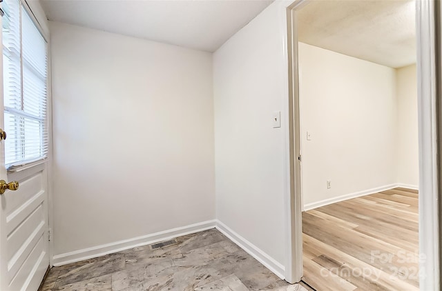 empty room featuring hardwood / wood-style flooring