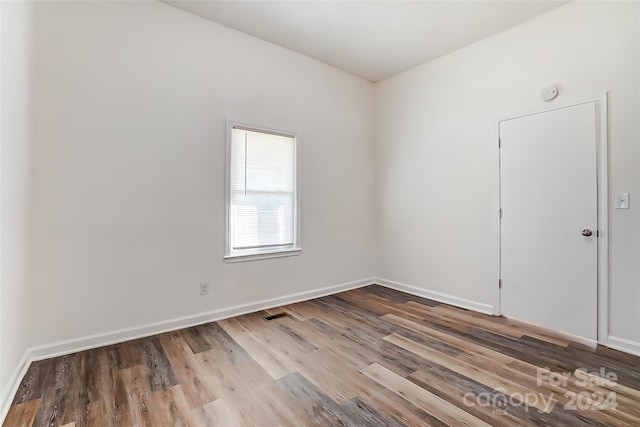 empty room with light hardwood / wood-style floors