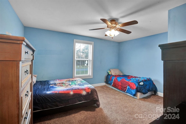 carpeted bedroom featuring ceiling fan