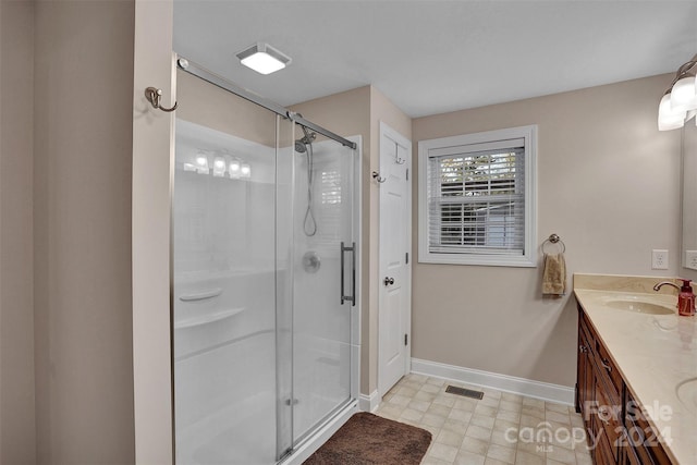 bathroom with vanity and walk in shower