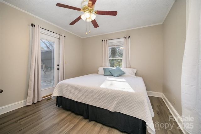 bedroom featuring crown molding, hardwood / wood-style flooring, ceiling fan, access to exterior, and a textured ceiling