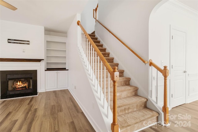 stairs with hardwood / wood-style flooring