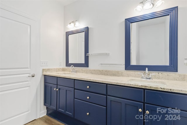 bathroom featuring hardwood / wood-style flooring and vanity