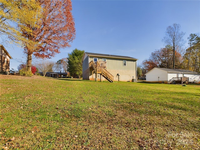 view of yard featuring a wooden deck