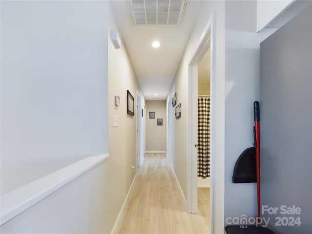 hall with light hardwood / wood-style floors