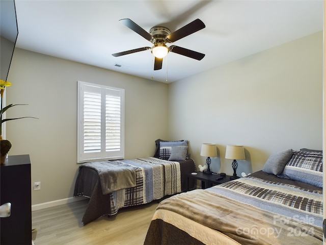 bedroom featuring ceiling fan and light wood-type flooring