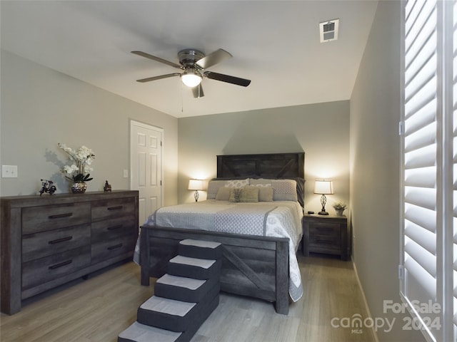 bedroom featuring hardwood / wood-style flooring and ceiling fan