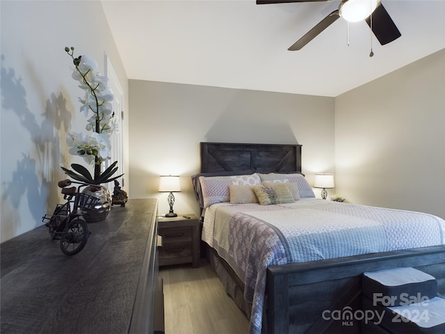 bedroom featuring ceiling fan and light wood-type flooring