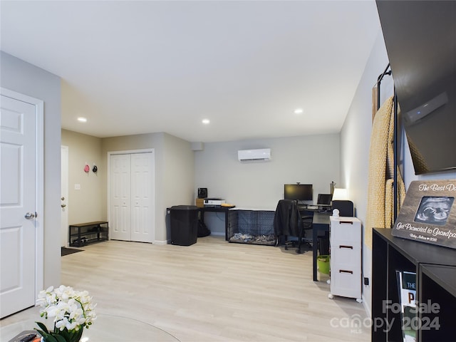 office space featuring light hardwood / wood-style floors and a wall mounted AC