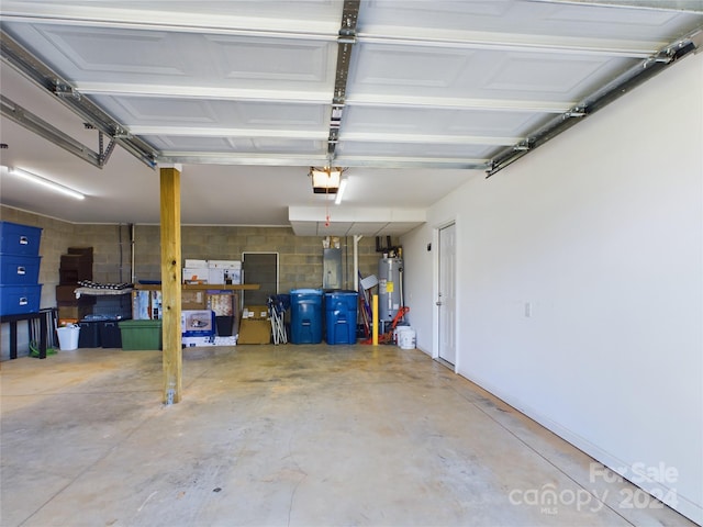 garage featuring water heater and a garage door opener