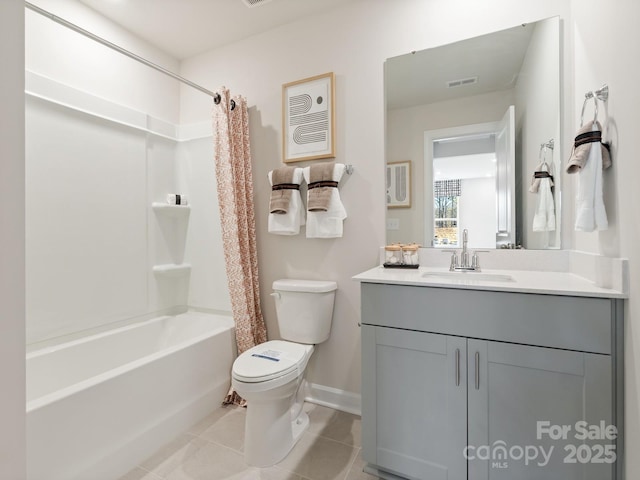 full bathroom with tile patterned flooring, shower / bath combination with curtain, vanity, and toilet