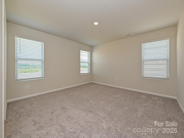 view of carpeted spare room