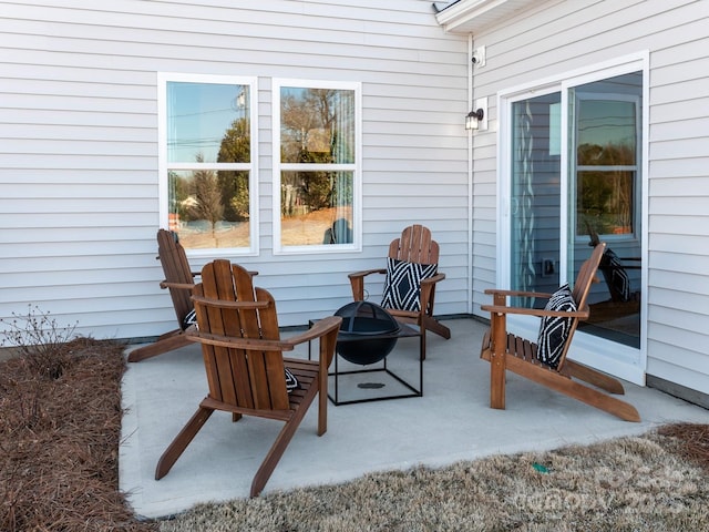 view of patio with an outdoor fire pit