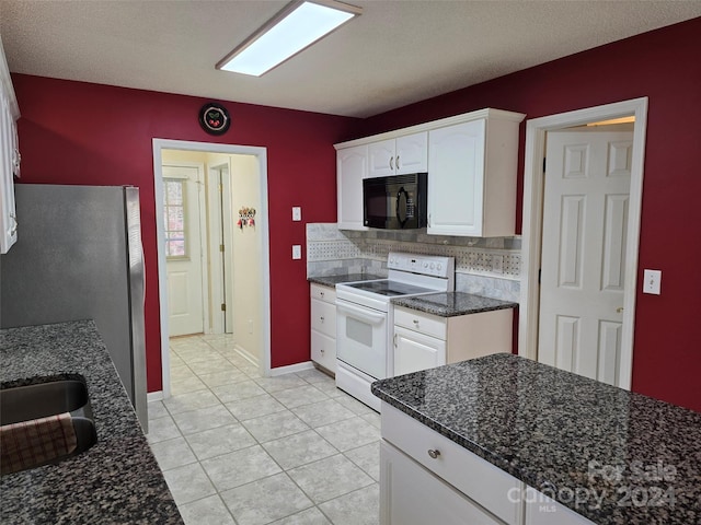 kitchen with white cabinets, tasteful backsplash, dark stone counters, and electric stove