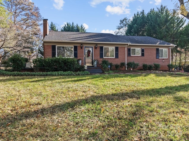 single story home with a front yard