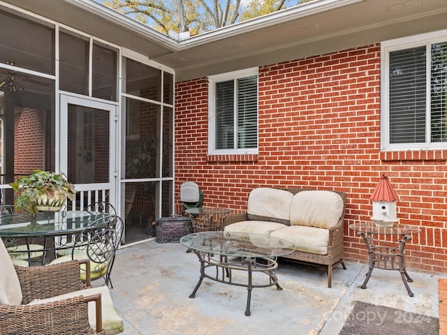 view of patio with a sunroom