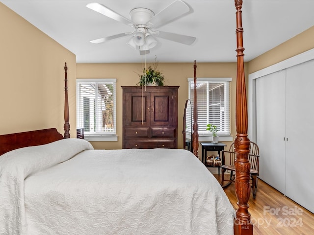 bedroom with a closet, ceiling fan, and hardwood / wood-style floors