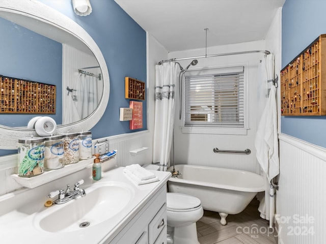 full bathroom with shower / bath combo, vanity, and toilet