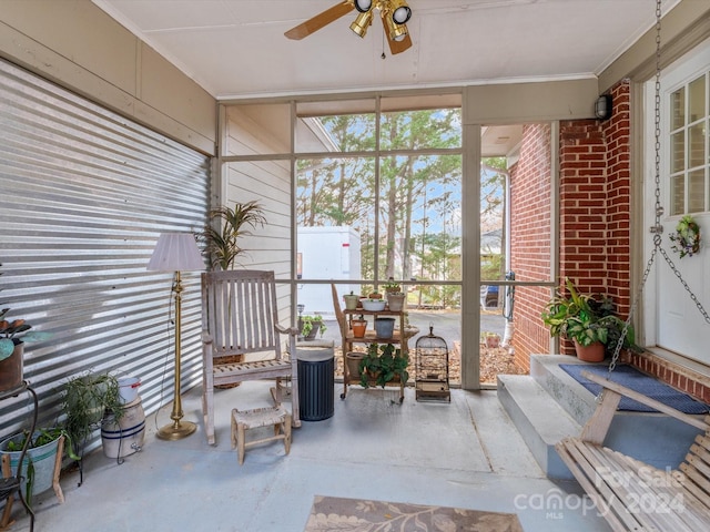 sunroom / solarium with ceiling fan