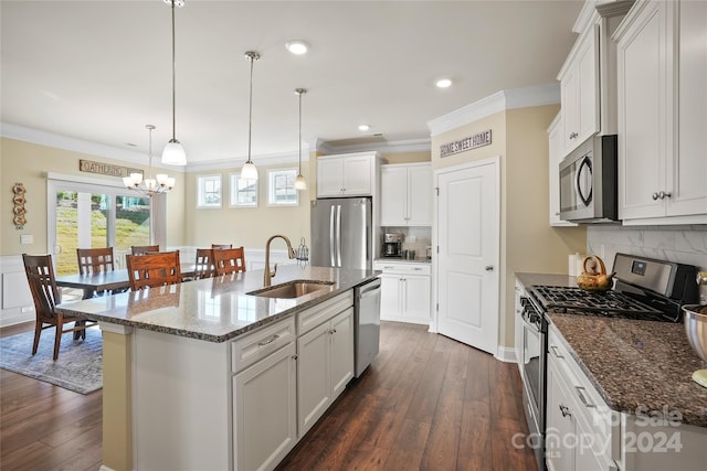 kitchen featuring white cabinets, appliances with stainless steel finishes, dark hardwood / wood-style flooring, and sink