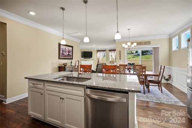 kitchen featuring a center island with sink, sink, light stone counters, stainless steel appliances, and a chandelier