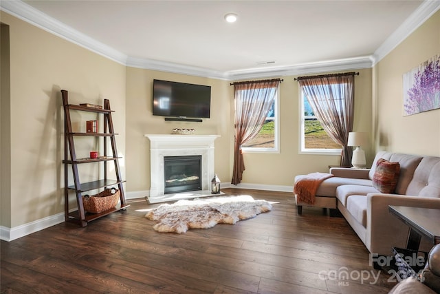 living room with dark hardwood / wood-style floors and ornamental molding