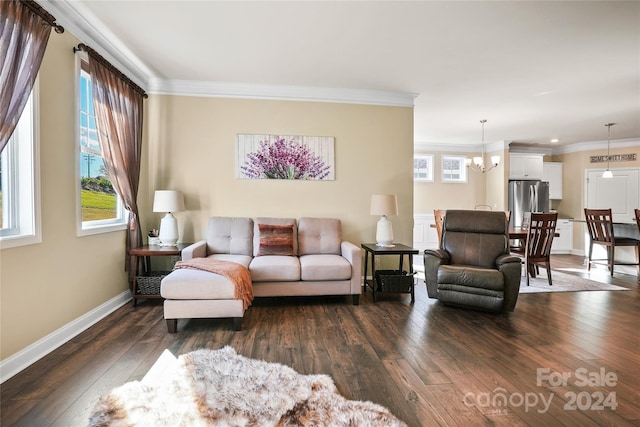 living room with ornamental molding, dark wood-type flooring, and a chandelier