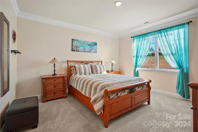 carpeted bedroom featuring crown molding