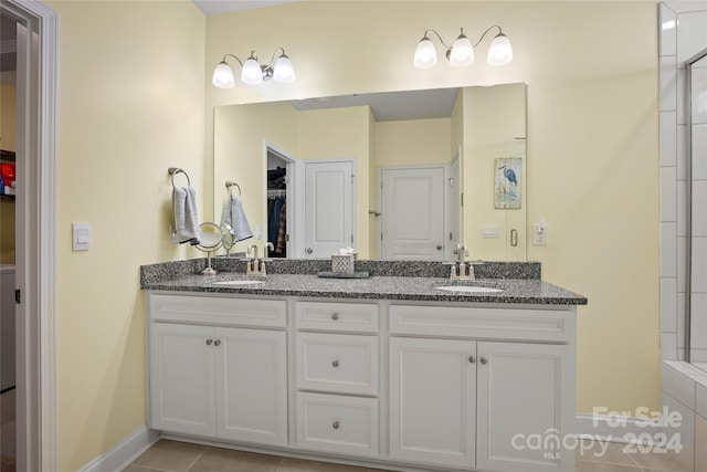 bathroom with tile patterned flooring and vanity